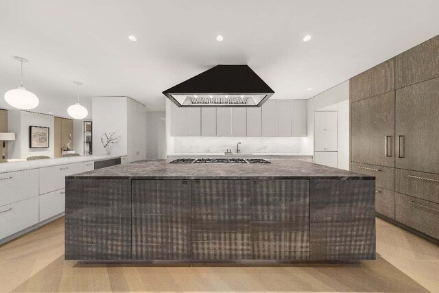 bathroom featuring vanity, hardwood / wood-style flooring, and shower with separate bathtub