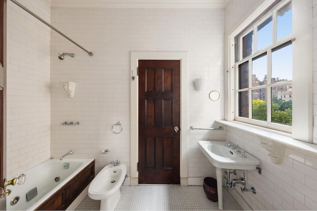 bathroom with tile patterned flooring, plenty of natural light, and tile walls