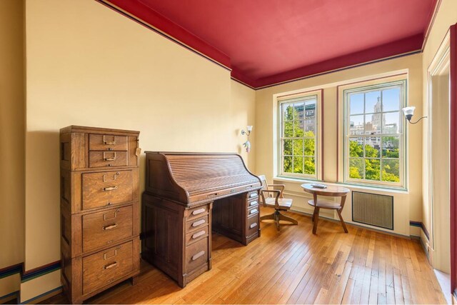 kitchen with dark wood-type flooring, crown molding, dishwasher, and sink