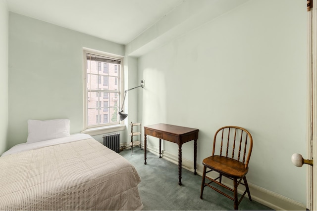 bedroom featuring radiator heating unit, carpet, and baseboards