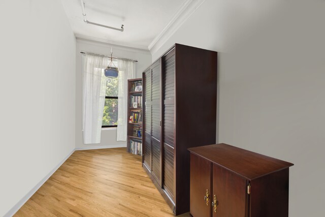 interior space featuring crown molding and dark hardwood / wood-style floors