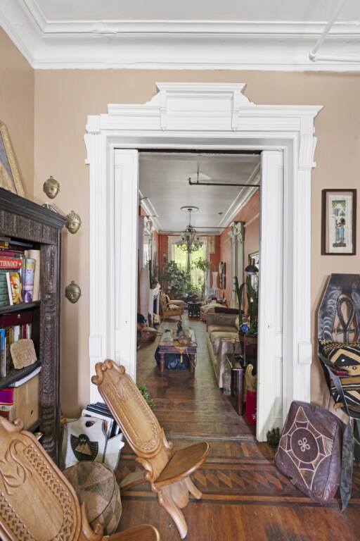 stairs featuring crown molding