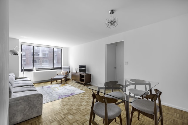 dining space featuring baseboards