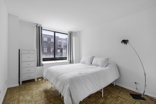 bedroom featuring baseboards