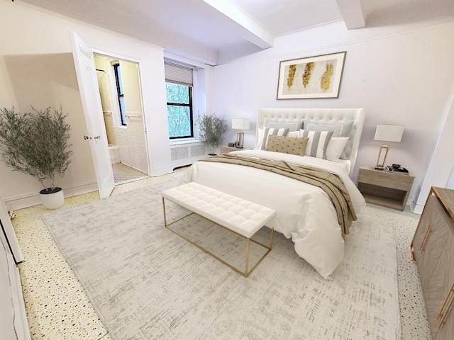 bedroom with ensuite bath and beam ceiling