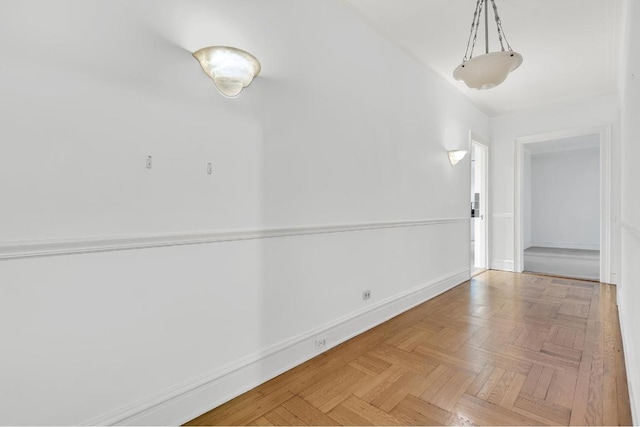 spare room featuring parquet flooring