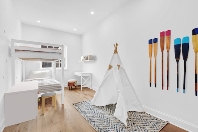 41-13 39th Pl Unit 3, New York City, NY 11104 - rec room featuring recessed lighting, baseboards, and wood finished floors