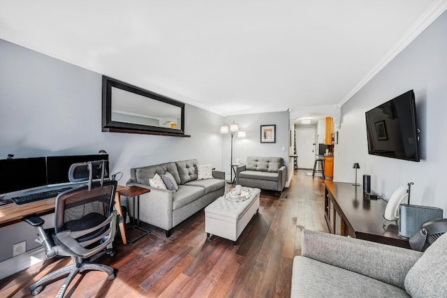 living room with dark hardwood / wood-style floors and crown molding