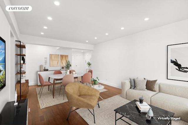 living room with dark hardwood / wood-style flooring