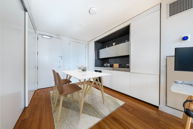 dining space featuring hardwood / wood-style floors