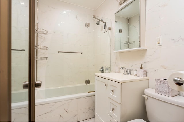 full bathroom featuring toilet, tasteful backsplash, combined bath / shower with glass door, tile walls, and vanity