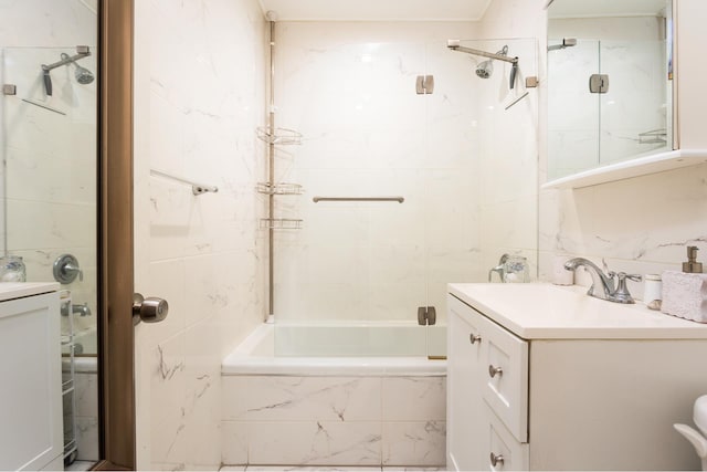 bathroom with decorative backsplash, vanity, tile walls, and tiled shower / bath