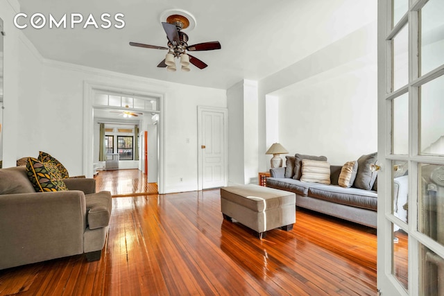 living area featuring ceiling fan and hardwood / wood-style floors