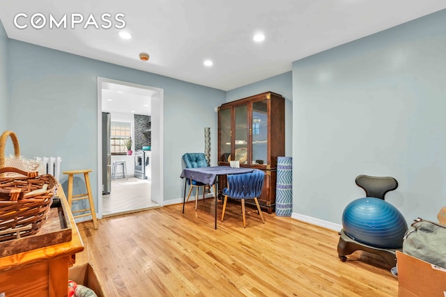 interior space with recessed lighting, light wood-type flooring, and baseboards