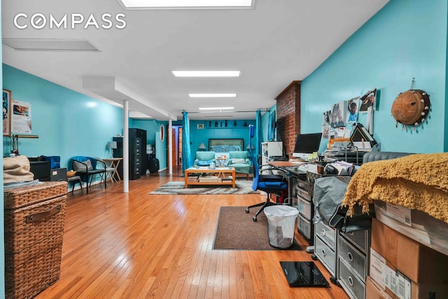 living area with hardwood / wood-style floors