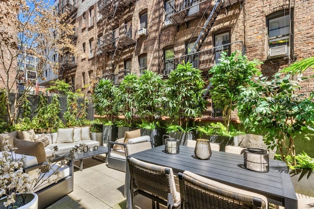 view of patio featuring cooling unit and an outdoor hangout area