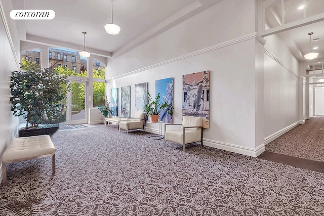 community lobby featuring a towering ceiling