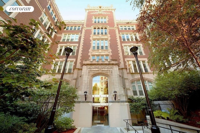 view of building exterior with fence