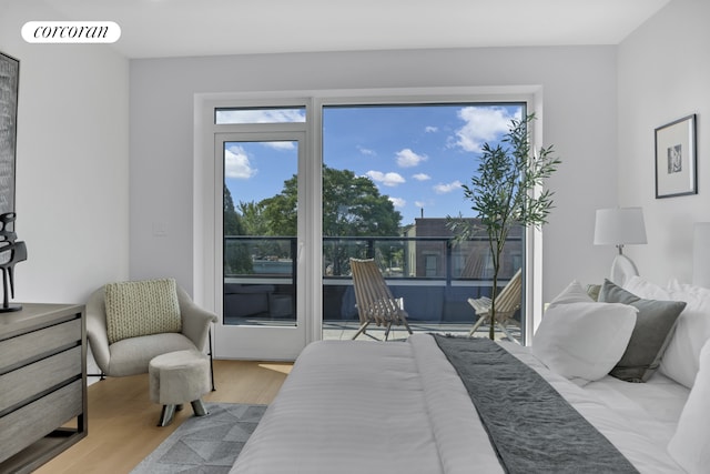 bedroom featuring visible vents and wood finished floors