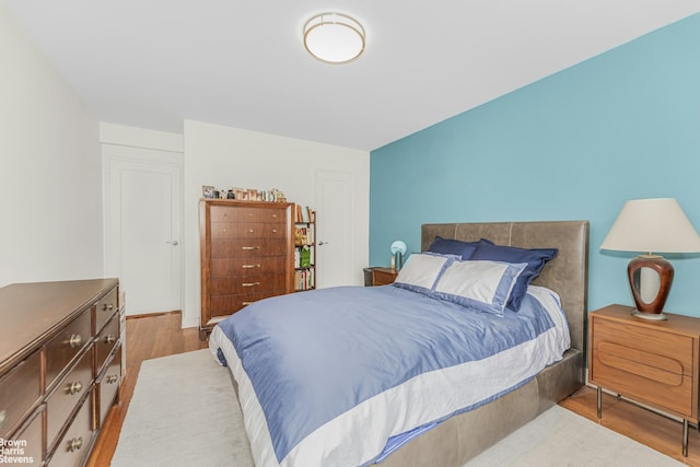 bedroom with wood finished floors