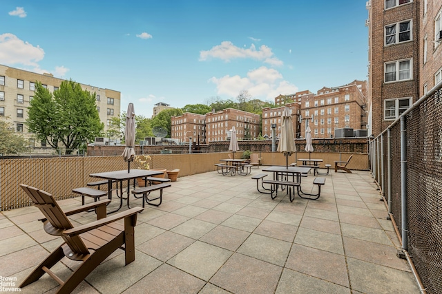 view of patio / terrace with outdoor dining space and fence