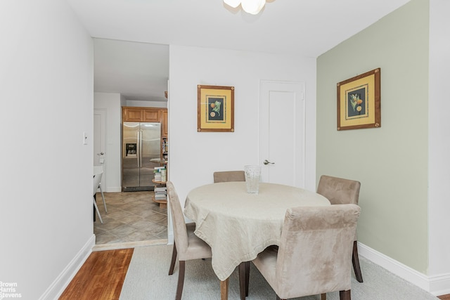 dining space featuring baseboards