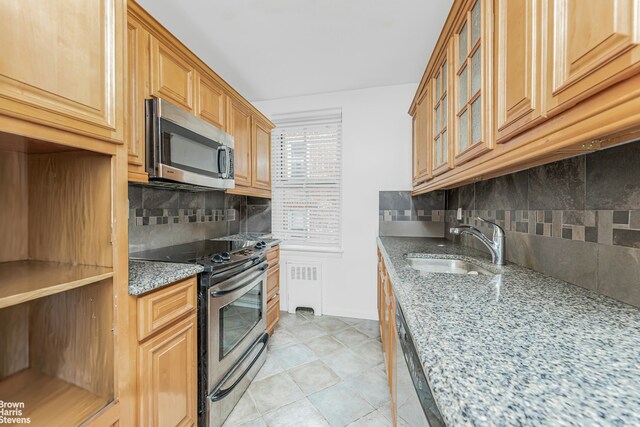 full bathroom with vanity, tile walls, shower / bath combination with glass door, and toilet