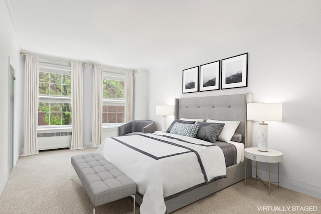 bedroom featuring light carpet