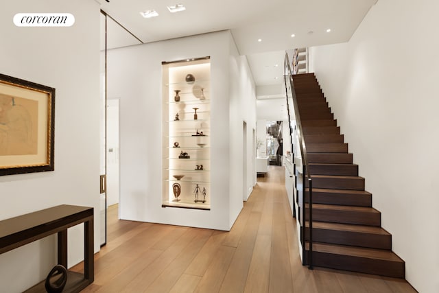 stairway featuring hardwood / wood-style flooring