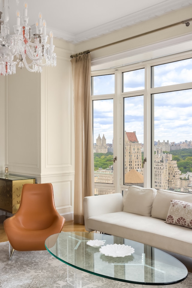 sitting room featuring a view of city and ornamental molding