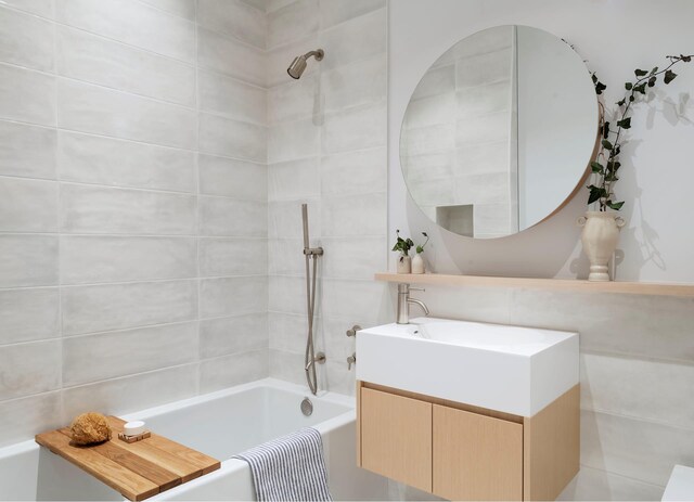 full bathroom with  shower combination and vanity