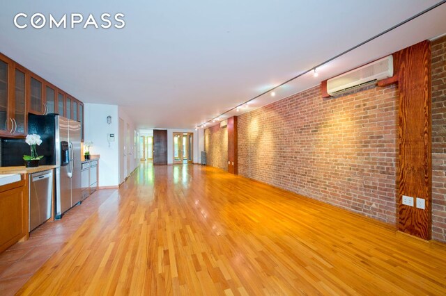 bedroom with ceiling fan and light hardwood / wood-style flooring