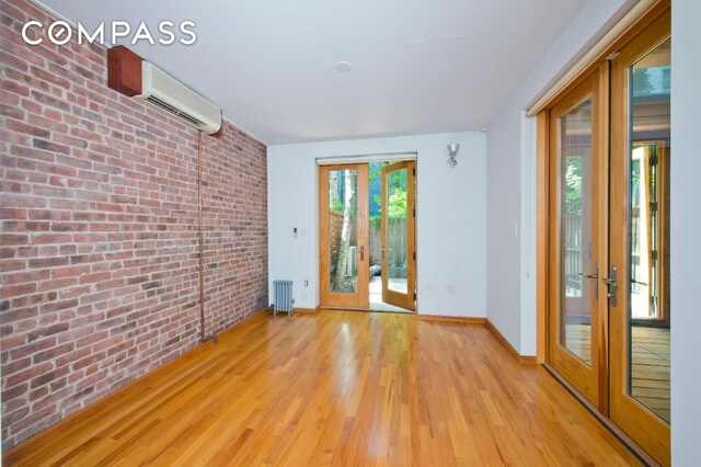 unfurnished room with ceiling fan and light hardwood / wood-style flooring