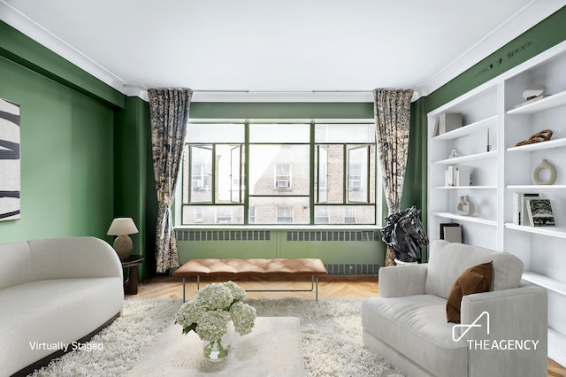 living area featuring radiator and wood finished floors