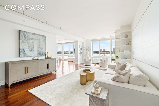 80 Riverside Blvd Unit 6B/L, New York City, NY 10069 - living room featuring dark wood-type flooring and baseboards