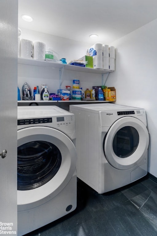 washroom with washing machine and clothes dryer