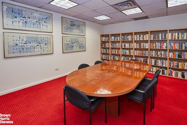 office area featuring carpet floors and a paneled ceiling