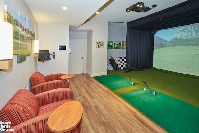 recreation room featuring hardwood / wood-style floors and golf simulator