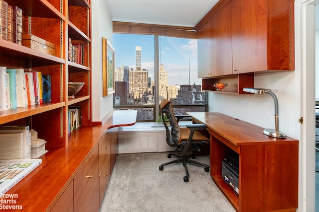 office area with light carpet and built in desk