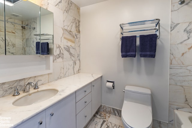 bathroom with toilet and vanity