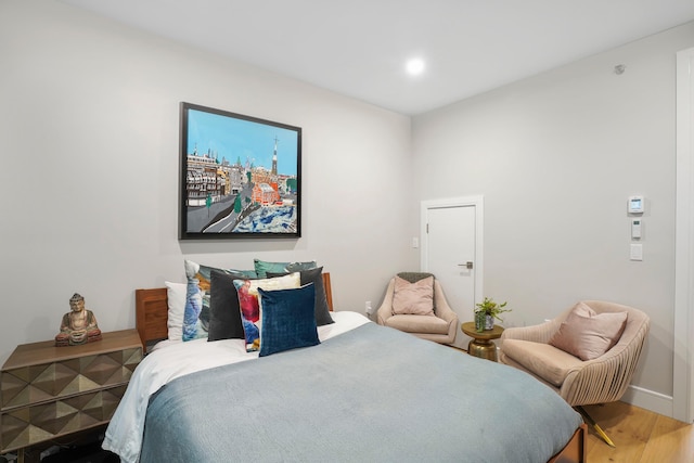 bedroom featuring wood finished floors