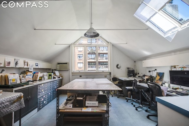 office space featuring lofted ceiling with skylight and a wall mounted AC