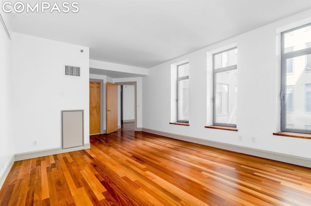 spare room featuring hardwood / wood-style flooring