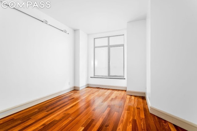 unfurnished room with light hardwood / wood-style flooring