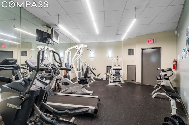 gym with a drop ceiling