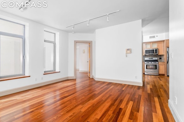 empty room with dark hardwood / wood-style flooring