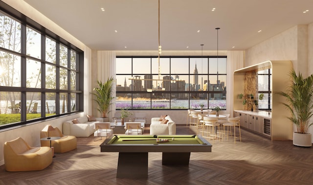 game room with a city view, a healthy amount of sunlight, and billiards