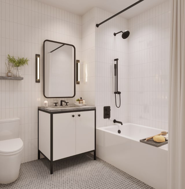 full bathroom with tile walls, tile patterned flooring, vanity, toilet, and bathing tub / shower combination