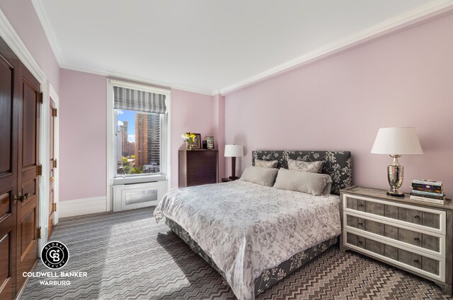 bedroom featuring crown molding