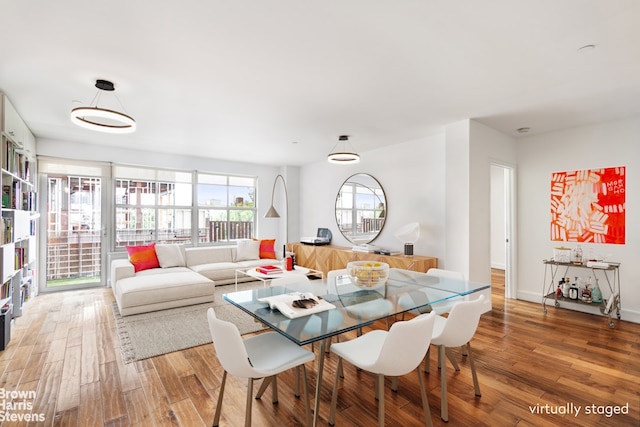 dining room with hardwood / wood-style flooring